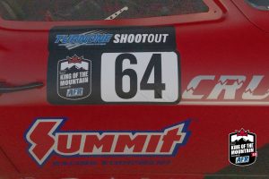 A red car with a number on the side of it.