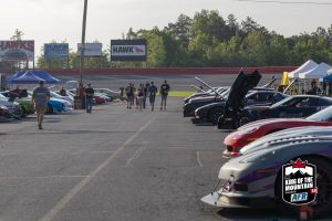 A group of cars parked in a parking lot.