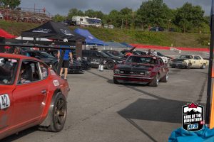 A group of cars parked in a parking lot.