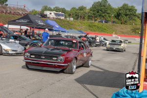A group of cars parked in a parking lot.