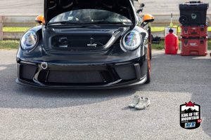 The hood of a porsche 911 gt3 is open.