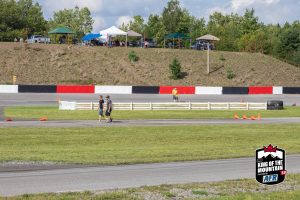 A group of people walking on a track.