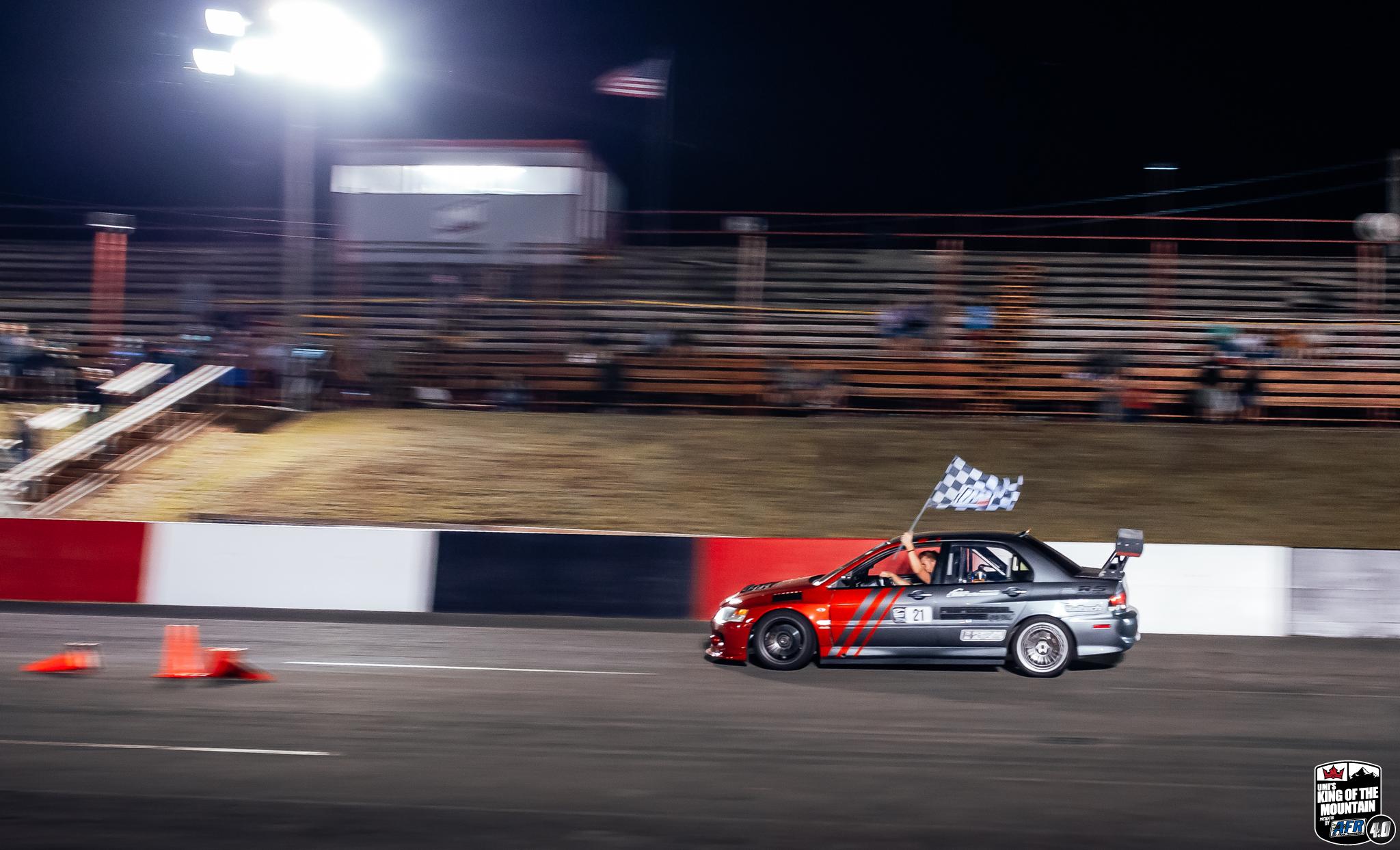 A jdm car drifting at night in the mountain